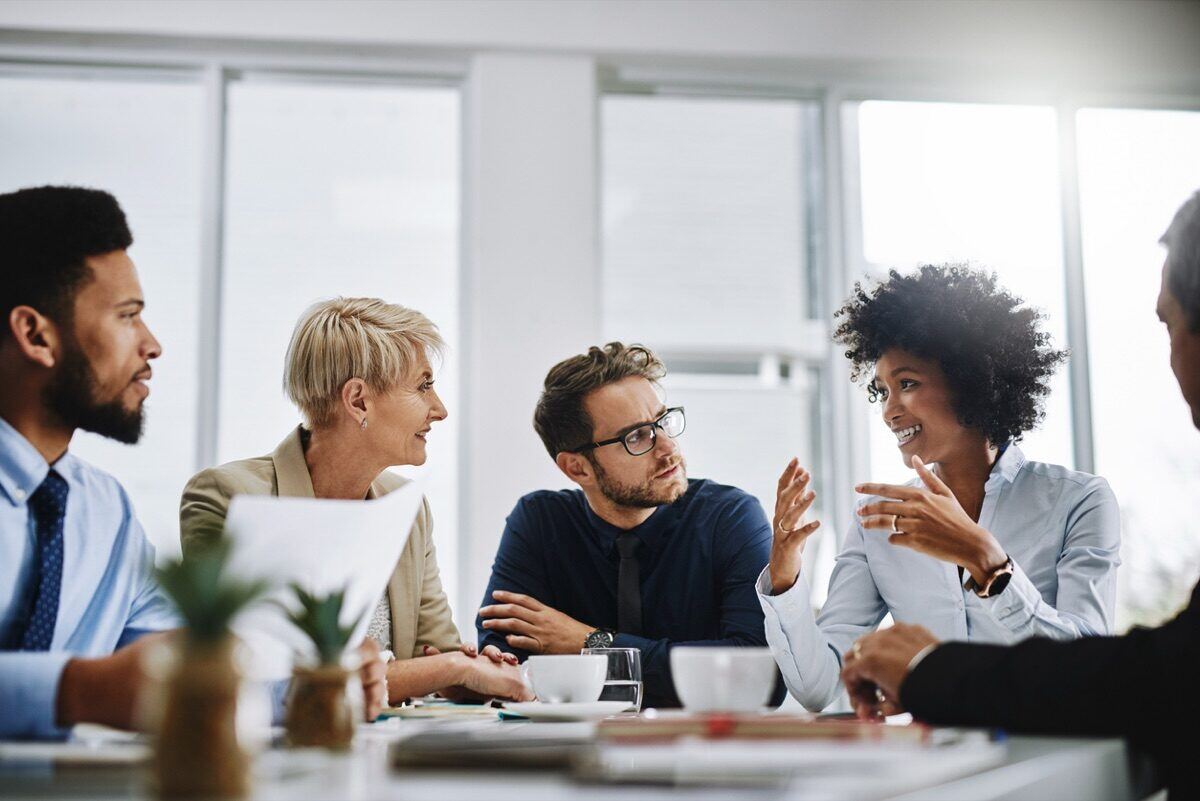 Professional team meeting with coffee cups
