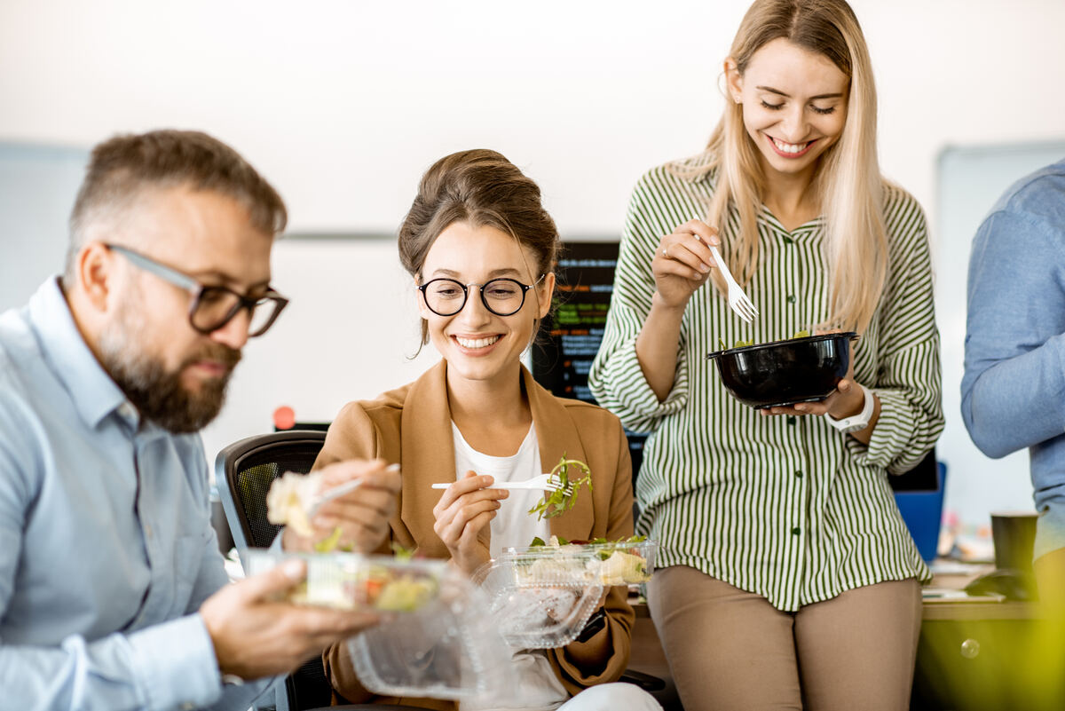 Employees enjoying fresh grab-and-go salads and meals from a smart cooler