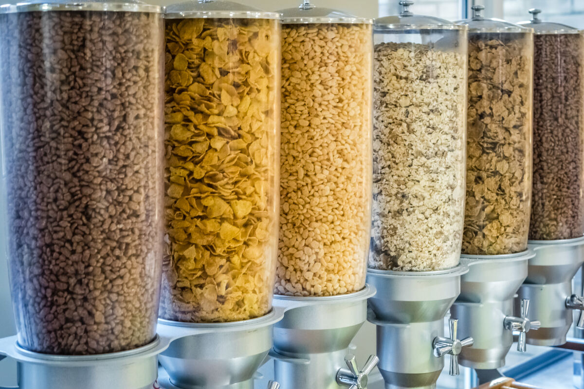 Stainless steel cereal dispensers in a modern office pantry